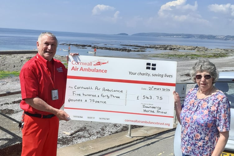 A CHEQUE for £500 is presented to Mark from the Cornwall Air Ambulance Trust by Jenny Jaycock