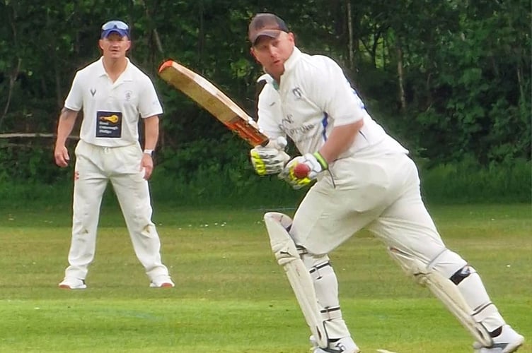 Gunnislake's Russell Holloway clips the ball into the leg-side during his half century.