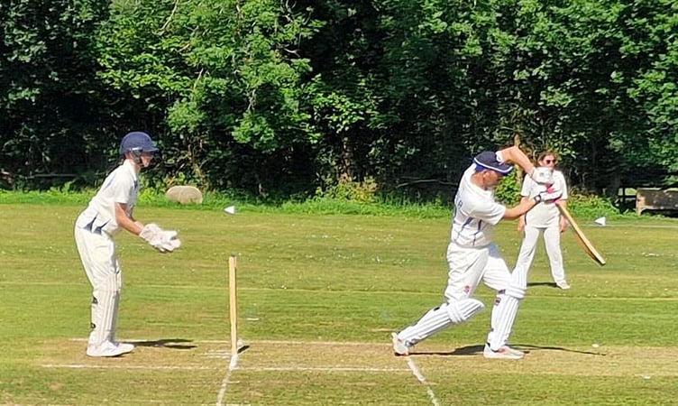 Gunnislake opener Sam Graber straight drives for four during his 54 not out on Sunday.