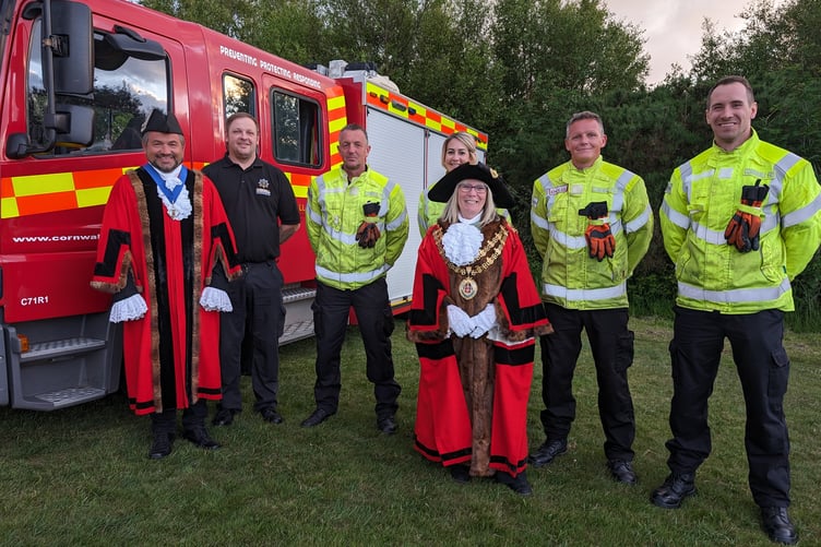 Councillor James Burden, Deputy Mayor of Bodmin (left) and Councillor Liz Ahearn, Mayor of Bodmin (centre) with representatives of Bodmin Community Fire Station
