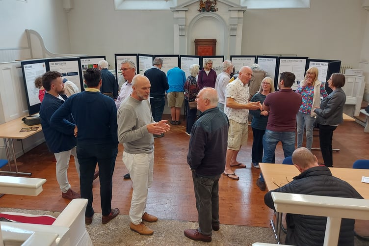 Residents and local councillors viewing and discussing the initial plans at a meeting in August 2023