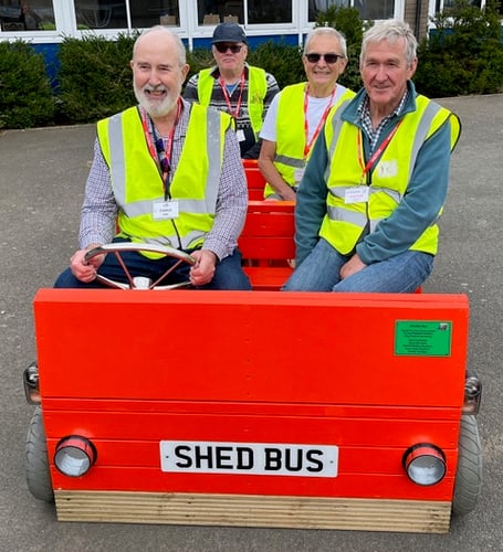 The playground bus recently delivered to Looe Primary School, with Chris Roy, Looe Shedders’ chairman, in the driving seat