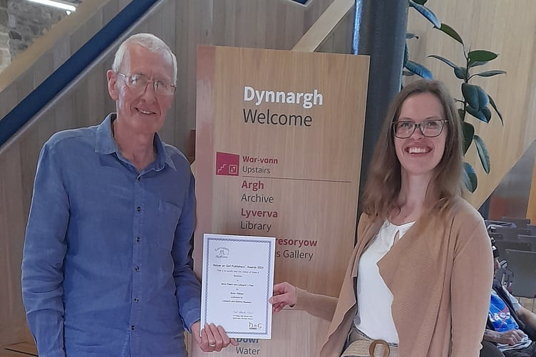 Iga Webb, Liskeard & District Museum manager, the publisher, and Brian Oldham, the author