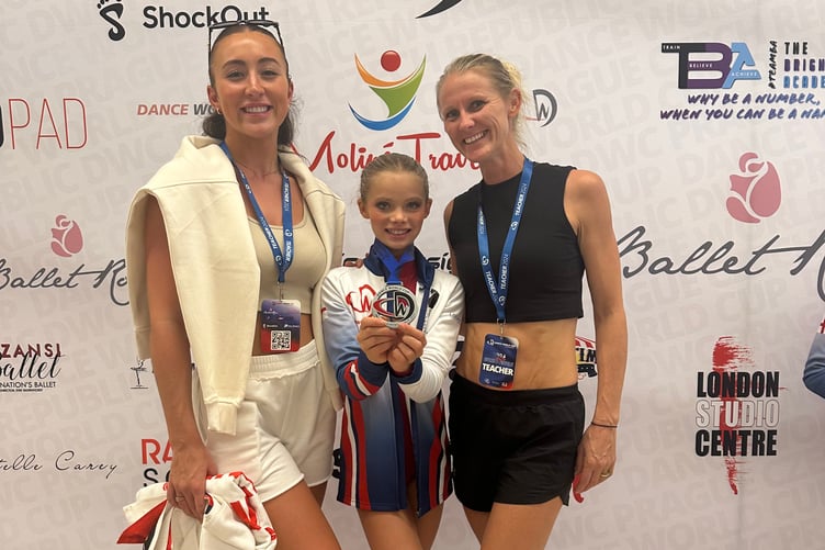 Nyana Engel won silver for her solo jazz piece, here with Moondance instructors.