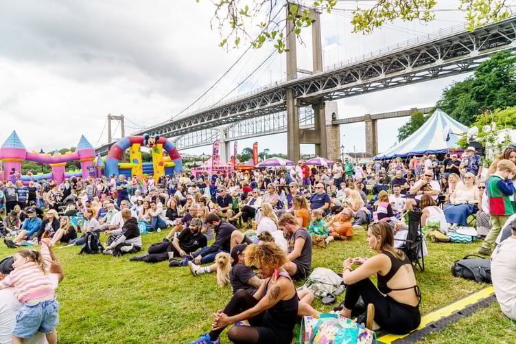 People sat watching music on stage at Saltash Regatta