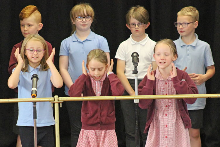 Pupils perform on stage