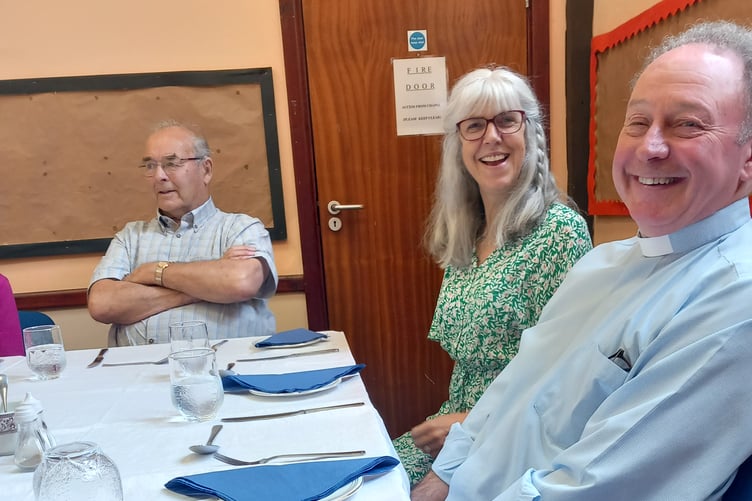 Rev David and Mrs Ali Moss preparing for their meal