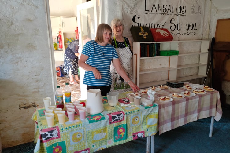 Ruth Talling and Gill Palmer serving cream teas during Lansallos Fete