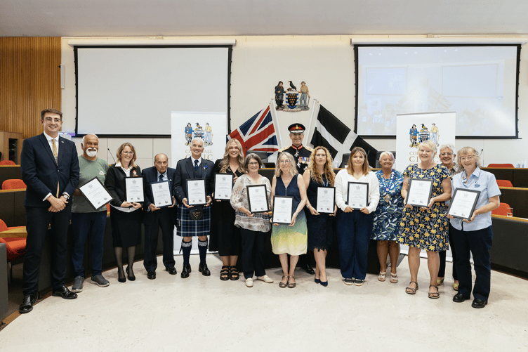 Representatives from the twelve Cornish voluntary groups nominated for a 2024 King’s Award for Voluntary Service, with the Lord Lieutenant of Cornwall, Colonel Sir Edward Bolitho KCVO OBE and Cornwall Council Chairman Cllr. Pauline Giles BEM.