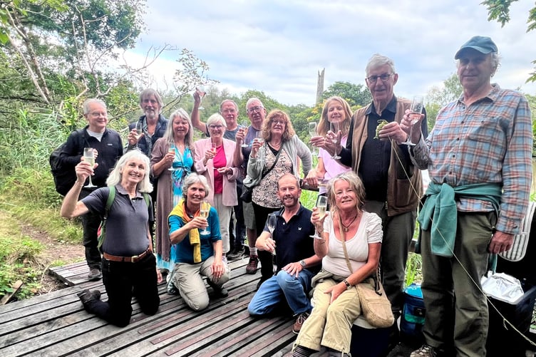LOCAL councillors and guests celebrate the re-opening of the boardwalks and viewing platform at Okel Tor Mine with owners Jon and Jenny Tully