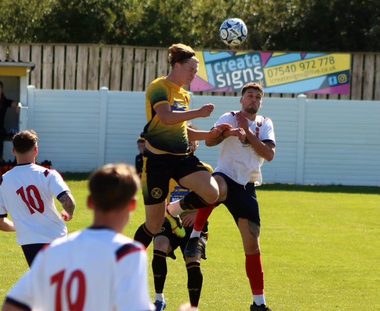 Torpoint's Fred Chapman, pictured heading clear against Wellington back in September, was twice denied in stoppage-time by Brislington keeper Ryan Smallwood. Picture: Torpoint Athletic