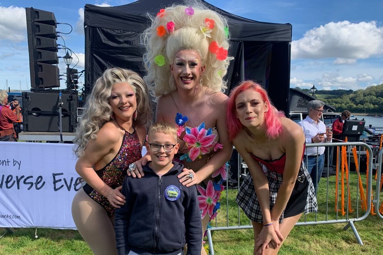 Charlie Nicholas, 8, pictured with host for Waterside festivities, Drag Queen Mandy Anne-Ket and entourage.