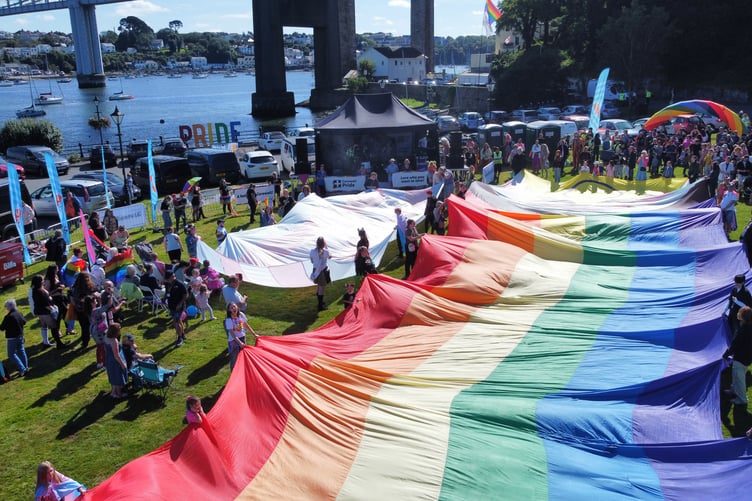 Saltash welcomes world's largest Pride flag to waterfront location for day of summer sun, love and acceptance.
