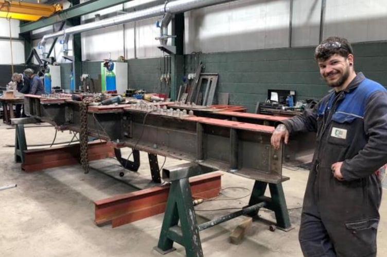 Austen in employment at the fabrication company.