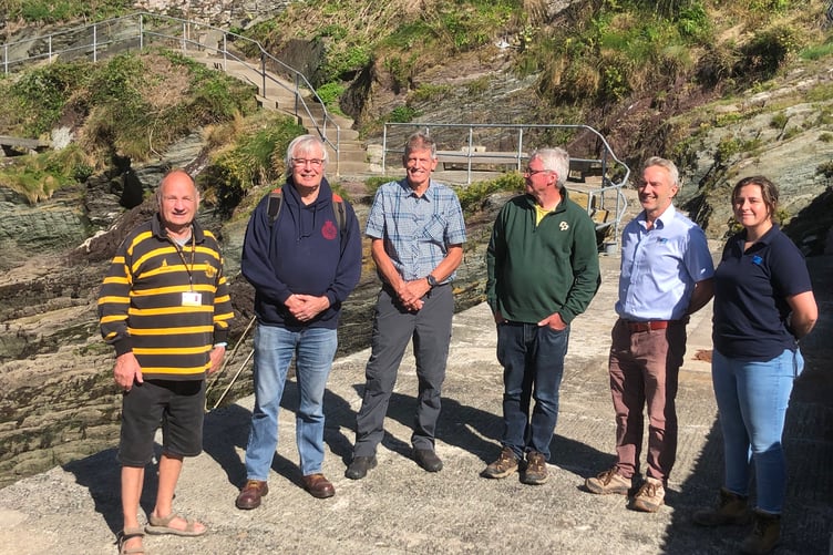 From left to right: Cornwall Cllr Jim Candy; Cornwall Cllr Armand Toms; James Lockyer, Consultant Civil Engineer to Polperro Harbour Trust; Peter Hickey, Chair Polperro Harbour Trust; Mark Hedges from contractors TMS Ltd and Lilly-Mae Nennstiel, TMS Ltd on the Prince of Wales Pier at Polperro.
