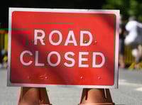 A38 closed after car overturns