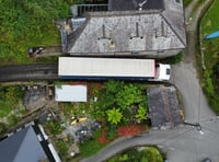 Haulage truck blocking lane in Saltash Forder to be craned out