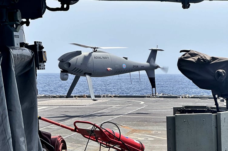 A Peregrine drone hovers over the deck of HMS Lancaster