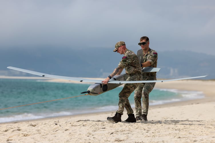 Royal Marines Commandos from 700X Naval Air Squadron launch a Puma drone from a beach in Portugal during the NATO exercise REPMUS24