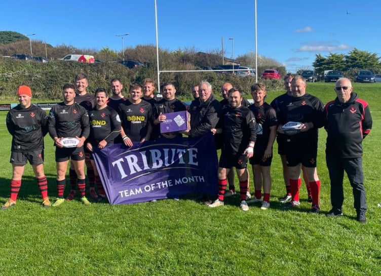 Liskeard-Looe's players and officials receive their Team of the Month award from Cornwall RFU representative, Denis Preece. Picture: Liskeard-Looe RFC