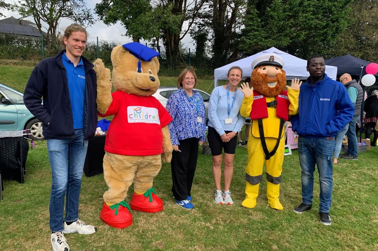Headteacher Janine Waring and Deputy Head Becky Marshall welcome their mascot visitors to their afternoon celebration. (Photo credit: Sarah Martin)