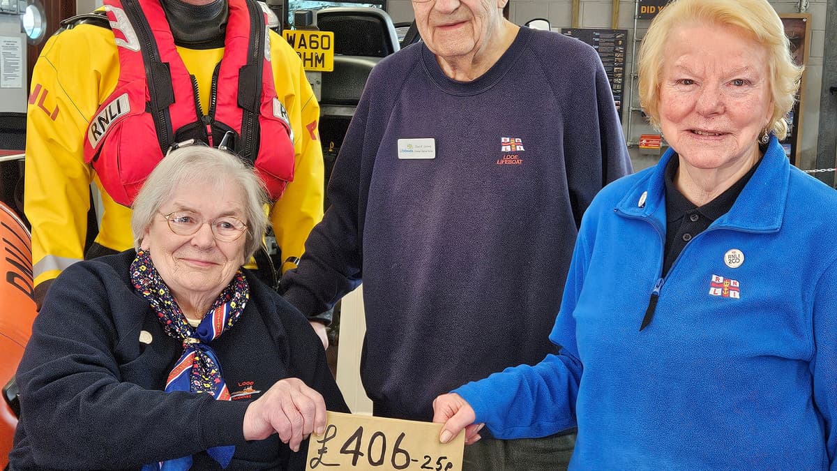RNLI fundraising volunteers ask for donations for lifeboat on their