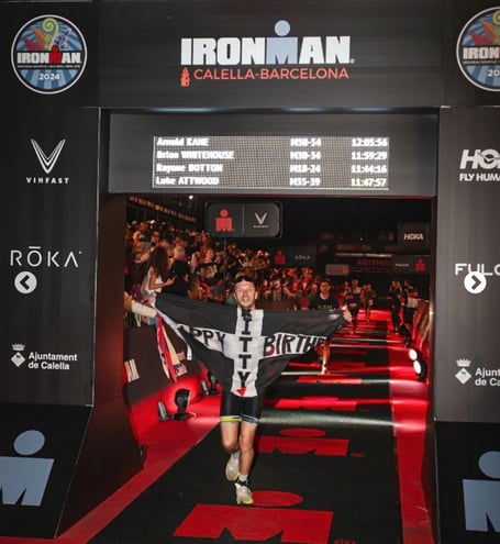 Luke Attwood crossing the finishing line