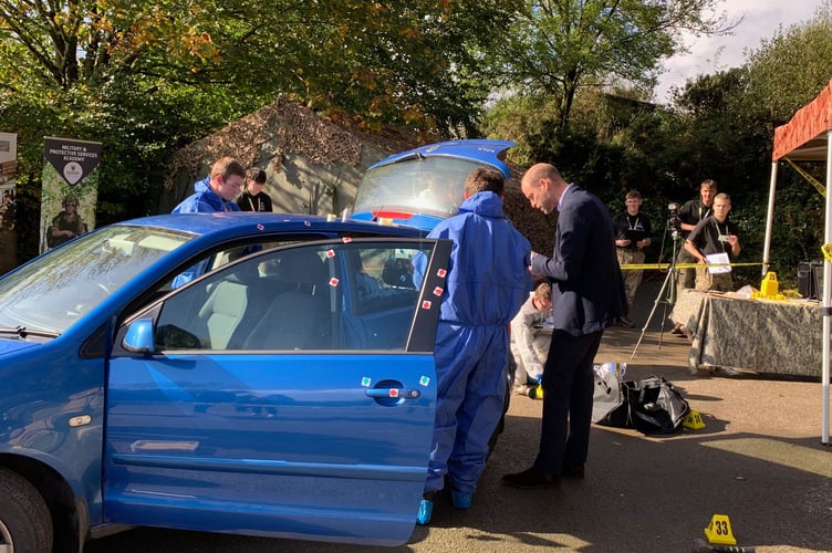 The Maps (Military and Protective Services Academy) students set up a crime scene of a burgled car for the Prince to dust for fingerprints. (Picture: Sarah Martin)