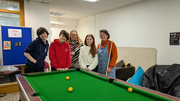 Young people at The Vault in Callington pictured with youth worker Nathalie and volunteer Ruth