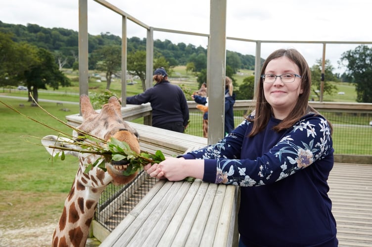 Ruby Reid fulfilling a lifelong dream of feeding giraffes at Longleat. (Picture: Stewart Williams)