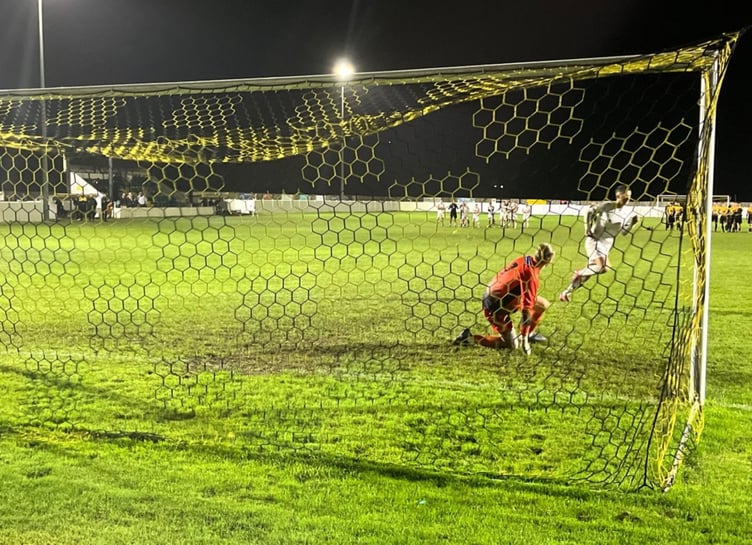 Tom Whipp runs off to celebrate after his penalty sealed St Austell's passage into the second round of the Les Phillips Cup. Picture: Kevin Marriott