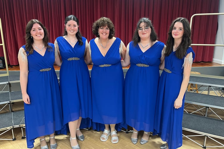 GraceNotes musical director Heidi Walsh (centre) is also a member of 'Mother Makes 5' —  comprising her daughters Megan, Heather, Elise and Lily. 