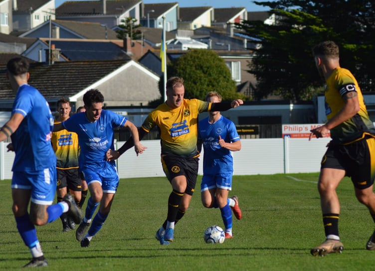 Torpoint Athletic's Elliott Crawford drives forward as his captain Luke Cloke looks on. Picture: Matt Burgoyne