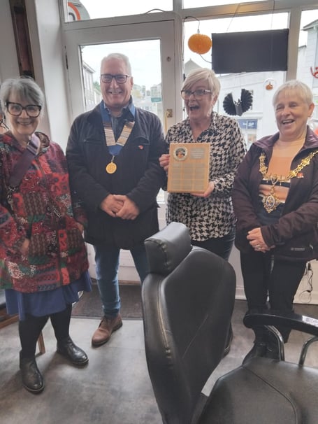 WINNER of the Halloween window competition Angie with town council members in Liskeard