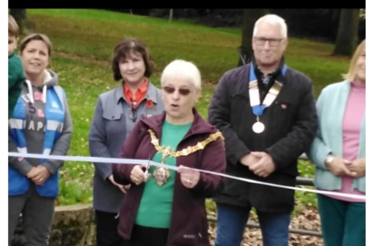 LISKEARD mayor Christina Whitty cuts the ribbon to mark the official handover of Castle Park to the Town Council