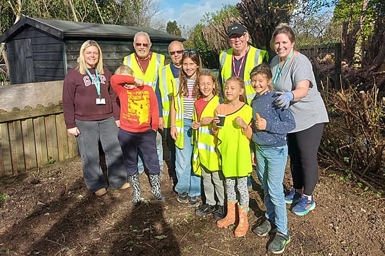 The Rotary club helped to clean up an area of land at Charlestown Primary School.