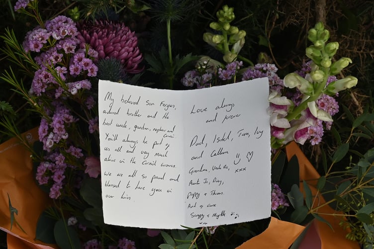 A card left among the flowers at the scene (Picture: Adrian Jasper)