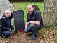 War graves volunteer lays poppies to remember