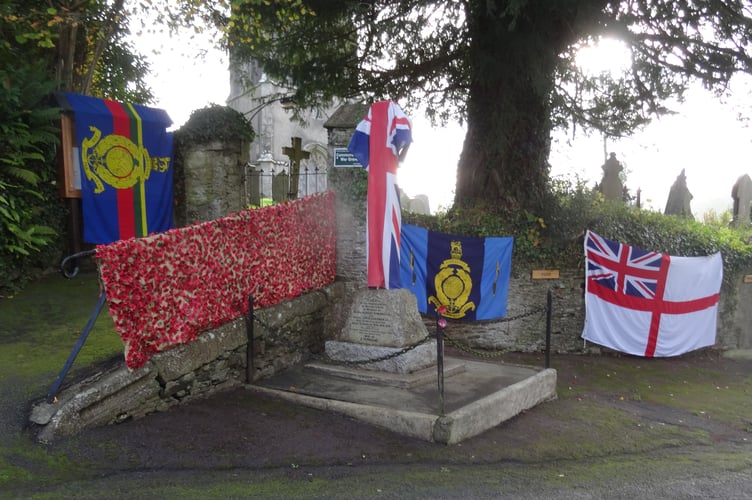 A poppy carpet and flags adorn the entrance to St Mary's Church in Botus Fleming on Remembrance Sunday. (Picture: Eric Distin)