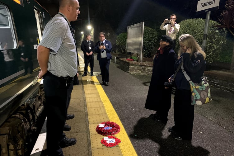 Two wreaths from Saltash are laid on the platform and bowed to before being placed on the GWR Poppies to Paddington train. (Picture: Sarah Martin)