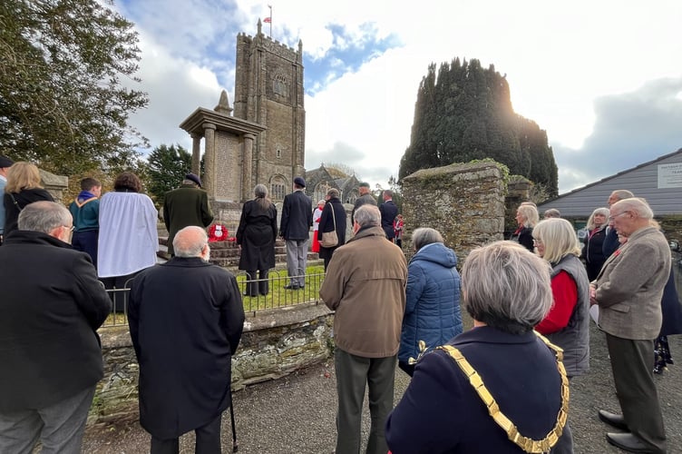 The congregation of St Stephen's Church pay their respects during a two-minute silence at their war memorial attended by the Mayor Julia Peggs. (Picture: STC)
