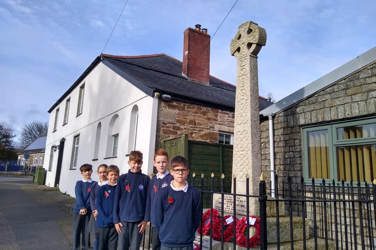 Pupils from Year 6 from Upton Cross Ace Academy at the War Memorial in Upton Cross on November 11. Left to right: Oliver, Natalie, Alexander, Dominic & Oliver