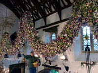 Last dried flower added to Christmas flower garland at Cotehele