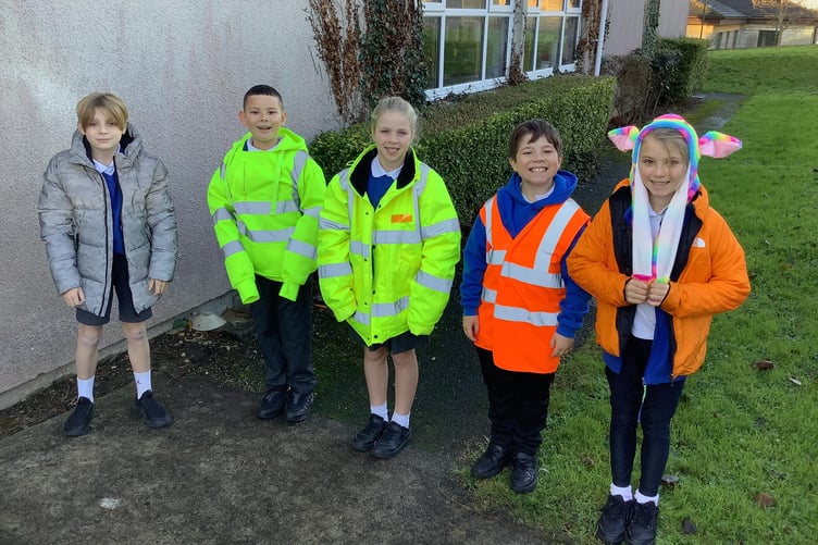 CHILDREN from Brunel School in Saltash got kitted out in high vis to raise awareness of road safety