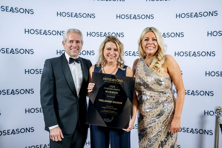 Antony Higgs from John Fowler Holidays, parent company of Trelawne Manor, and Cathie Higgs, Sales Director at John Fowler Holidays receive the park’s award from Gemma Brown, General Manager of Hoseasons (left to right). (Picture: Hoseasons)