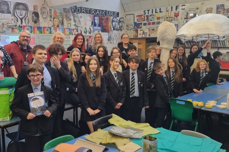 The team from Saltash Community School who created this year's Mary Poppins umbrella to a winning design by Kaye Nicholls in workshops led by local artist Jill Hudson. (Picture: Saltash Christmas Festival)