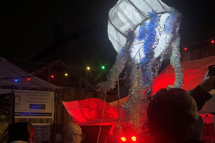 Festive lanterns made during workshops earlier this month were held high as the procession made its way from Millpool to fireworks and festivities at the seafront. (Picture: Looe Town Council)