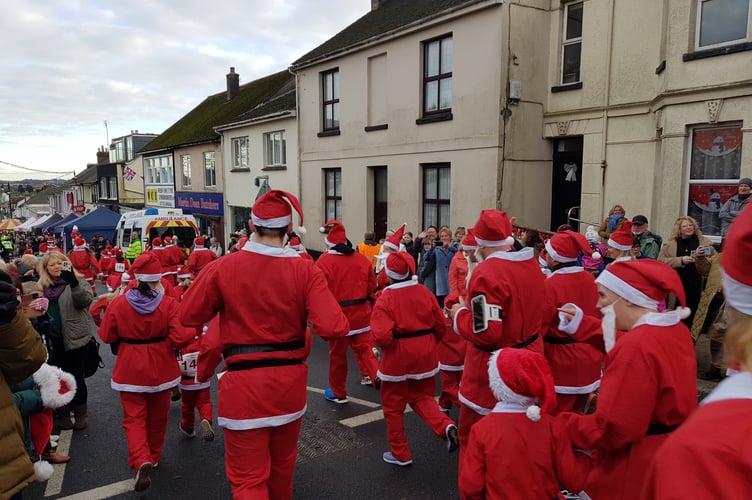 Runners taking part in the annual Saltash Santa Run, which this year has been postponed due to Storm Darragh