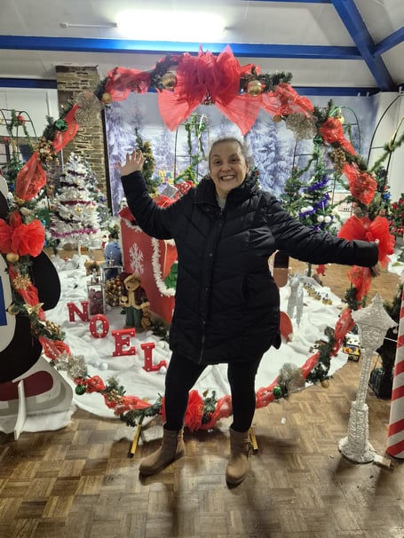 Beat4Autism director Lizeta Fellows is all smiles in front of the Christmas grotto at St James' Church in Torpoint