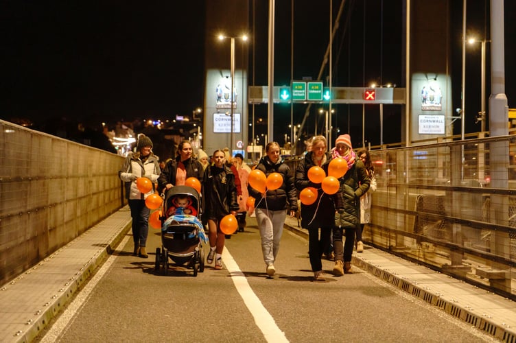More than 40 women, girls and men joined the solidarity walk across the Tamar Bridge on the final day of the 16 days of Action campaign. (Picture: Mike Pitches Photography)